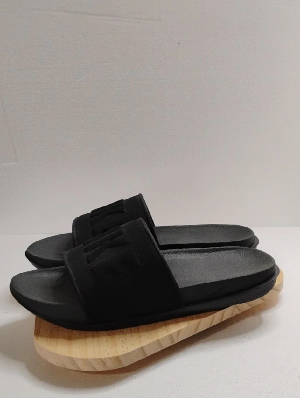 Nike Black Slide Sandals with Embossed NIKE Strap